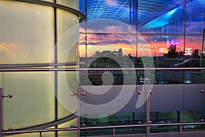 Airport and sunset sky reflected in windows