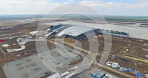Airport and surrounding area. An aerial view of the airport hangers and surrounding area. High level aerial view of the