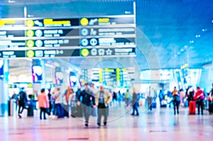 Airport terminal blurred crowd of travelling people