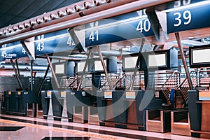 Airport terminal check-in area with counters