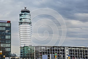 Airport tower in Vienna Austria with overcast sky.