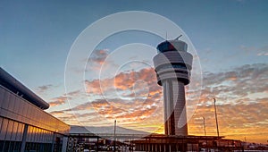 Airport traffic control tower at dramatic sunset in Sofia, Bulgaria photo