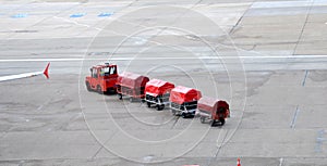 Airport trucks handling baggage