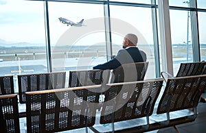 Airport waiting, black man back and phone for work travel, plane and air flight. Businessman, mobile connection and