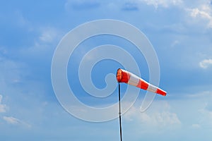 Airport windsock on blue sky background indicate local wind dire