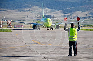 Airport worker directing