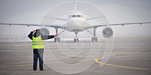 Airport worker signaling