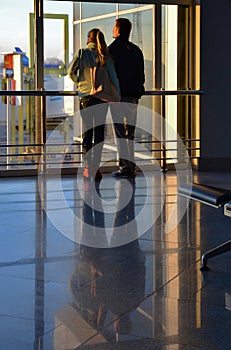 Airport. Young couple awaiting morning flight