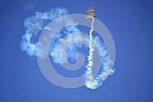 Airshow skydivers white smoke figures