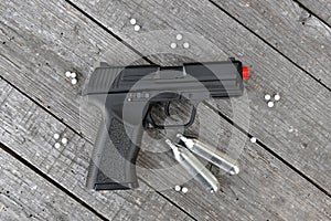 Airsoft gun with gas canisters and shots