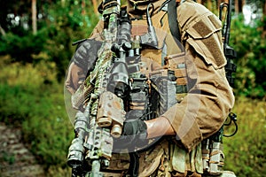 Airsoft man in amunition hold the gun