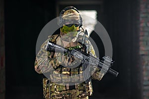 Airsoft strikeball player in military soilder