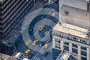 Airstrip of New York City, with buildings and streets filled with the famous yellow taxis during the day. Concept of travel and