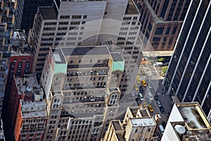 Airstrip of New York City, with buildings and streets filled with the famous yellow taxis during the day. Concept of travel and