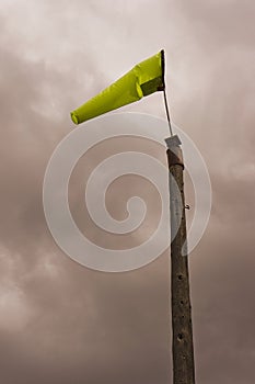 Airstrip windsock atop wooden pole