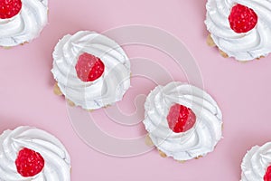 Airy protein pastry basket with red raspberry on wooden table . flat lay