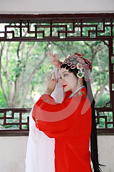 Aisa Chinese opera woman.Peking Beijing Opera in the garden outdoor china traditional costume bride role drama play