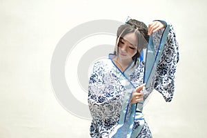 Aisan Chinese woman in traditional Blue and white Hanfu dress