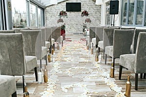 Aisle between chairs prepared for the newlyweds walk