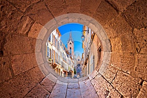 Aix En Provence scenic alley and church view through stone window photo