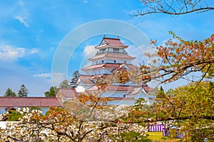 Aizu-Wakamatsu Castle with cherry blossom in Aizuwakamatsu, Japan