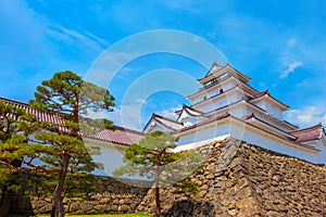 Aizu-Wakamatsu Castle with cherry blossom in Aizuwakamatsu, Japan