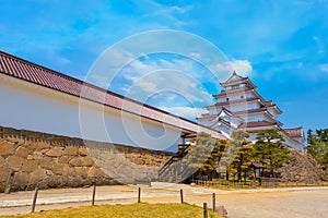 Aizu-Wakamatsu Castle with cherry blossom in Fukushima, Japan