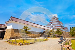 Aizu-Wakamatsu Castle with cherry blossom in Fukushima, Japan