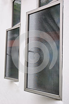 Ajar casement windows with window films.