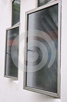 Ajar casement windows with window films. photo