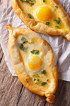 Ajarian khachapuri, with egg and cheese closeup. vertical top vi