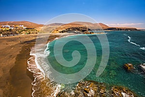 Ajuy beach with vulcanic mountains on Fuerteventura island