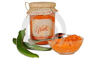 Ajvar - delicious dish of red and green peppers, onions, garlic, eggplant. Ajvar in jar.