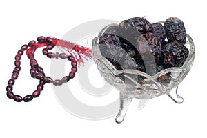 Ajwa  Dates and  rosary on  white background. Ajwa dates is favoured by Prophet Muhammad SAW