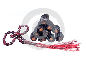 Ajwa  Dates and  rosary on  white background. Ajwa dates is favoured by Prophet Muhammad SAW