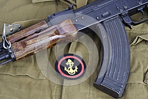 AK47 with Soviet Army Marines shoulder patch on khaki uniform