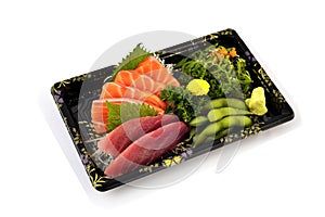 Akami or tuna and Salmon Sashimi fill with Pigeon pea and spicy Seaweed salad Japanese tradition food in delivery low cost box set