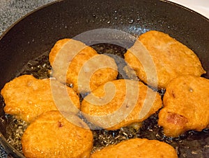 Akara being fried in oil