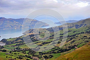 Akaroa Harbor lake and hills in New Zealand