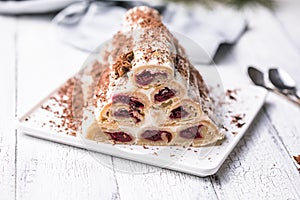 Ð¡ake monastery hut on white plate. Christmas dessert