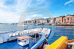 Aker Brygge from ship docked in port Oslo, Norway photo