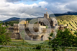 Akhaltsikhe (Rabati) Castle, medieval fortress in Akhaltsikhe, Georgia during sunset with cloudy sky in the background photo