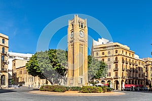 Al-Abed Nejmeh Square clock tower with tree and buildings around, Beirut, Lebanon