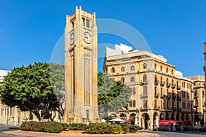 Al-Abed Nejmeh Square clock tower with tree and buildings around, Beirut, Lebanon