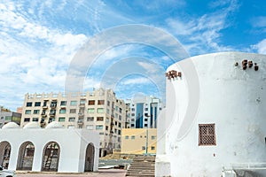 Al-Balad old town fortress remains with modern buildings, Jeddah, Saudi Arabia photo