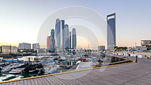 Al Bateen marina Abu Dhabi day to night timelapse with modern skyscrapers on background