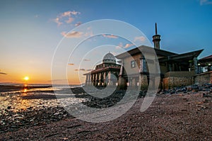 Al-Hussain Mosque by the sea with sunset views located in Perlis Malaysia.