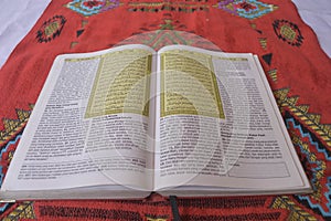 Al Quran di sajadah dengan latar belakang putih. photo