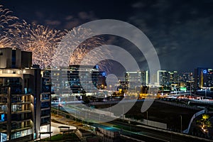 Al Raha Beach at Night with Fireworks Display over Yas Island in Abu Dhabi