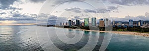 Ala Moana Beach Park and Magic Island, with Kakaako skyline of Honolulu  at sunset